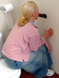 FreshPornPics presents: Blonde girl Jamie sits on the toilet and blows a black gloryhole dong